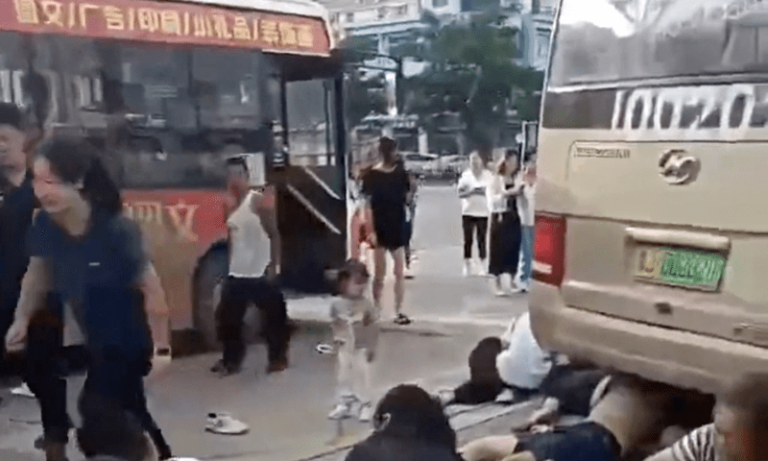 A school bus ploughed into a crowd of people outside a middle school in eastern China on Tuesday, killing 11 parents and students, state media reported.